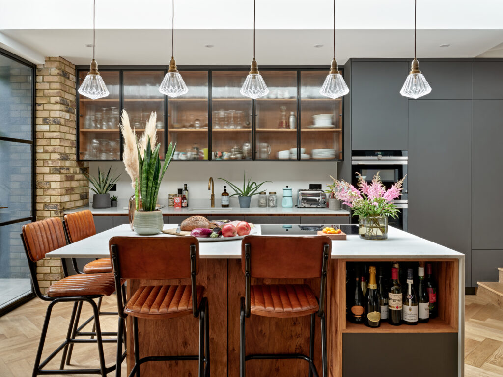 Hornsey refurbishment: kitchen island with leather bar stools and glazed cabinetry