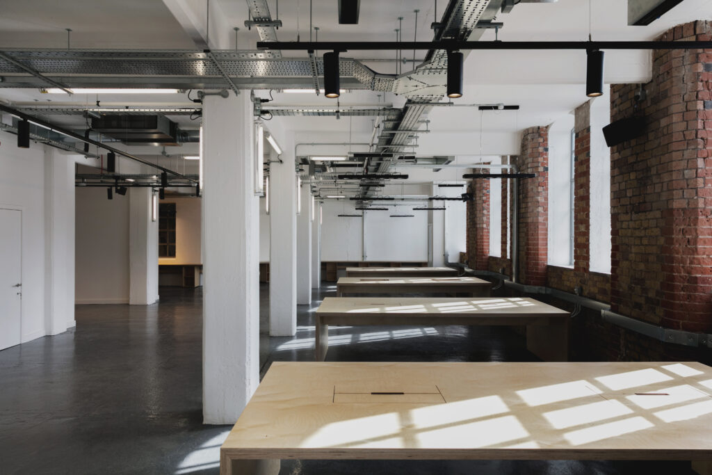 Tea Building commercial fit-out in Shoreditch with exposed brick and plywood joinery